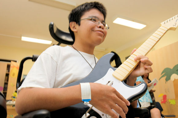 Guitar hero at Sunny Hill Health Centre for Children, Vancouver, BC